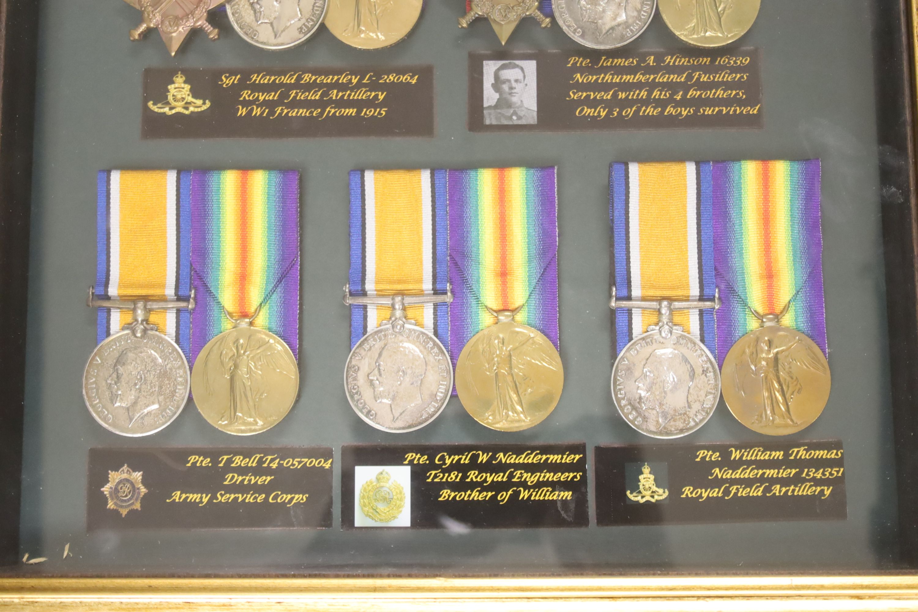 Five WW1 medal groups in one frame.